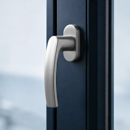 Close-up of a brushed-metal window handle